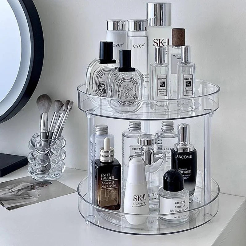 Clear 2-tier rotating organizer holding skincare on a vanity